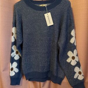 Chic Blue Sweater with White Floral Design